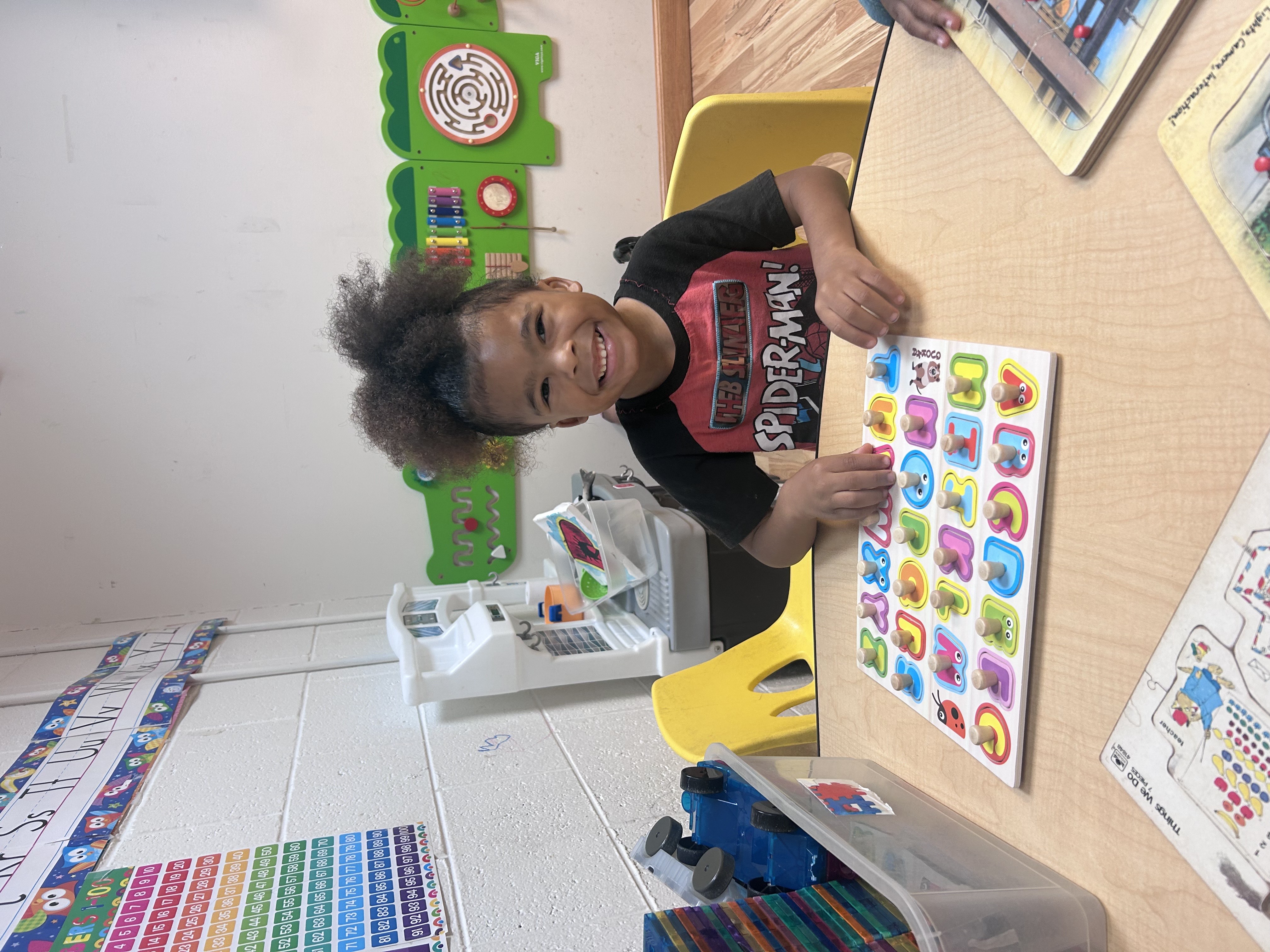 Child working on puzzle